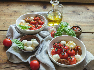 Salad. Baked tomato, basil, garlic with mozzarella cheese, ceramic dishes. cooking, cooked dish