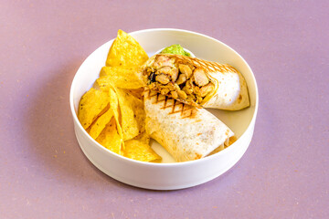 Chopped chicken wrap with sweet yellow curry sauce with corn chips