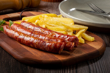 Grilled German sausage with french fries.