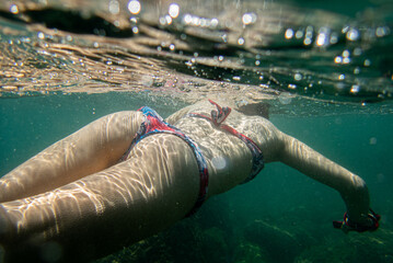 Sexy girl in water, snorkeling bikini.