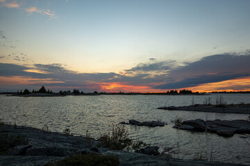 Sundown  on a rocky shore at sunset in Northern Georgian Bay (Lake Huron) Ontario Canada.  Shot in September.