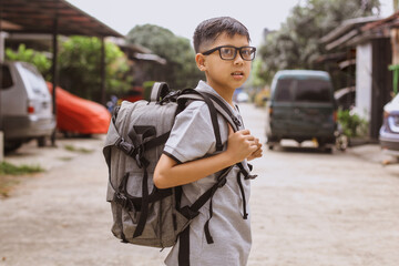 Asian student boy with glasses ready going to school