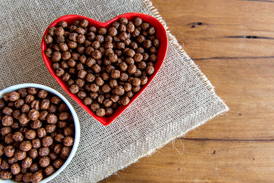 Bowl of Cornflakes on the breakfast table.