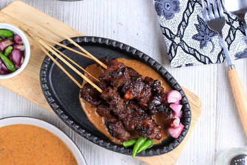 Top View Homemade Indonesian Lamb Satay (Sate Kambing) is Popular Menu for Idul Adha (Eid al Adha).