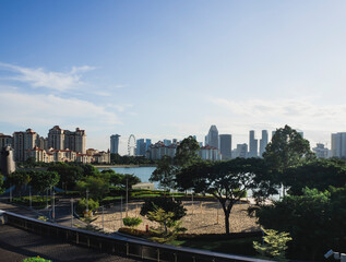 Fototapeta premium View of a park with Kallang River and Singapore skyline in the background