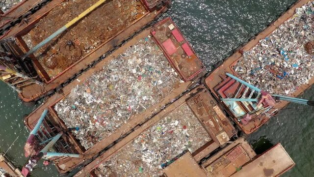 Recycling scrap metal plant over crane load a cargo ship vessel