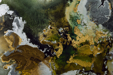 Golden Waves. Abstract Alcohol ink. Trendy wallpaper. Natural pattern. Abstract artwork. Modern fluid art. Luminous, free-flowing. Luxurious background