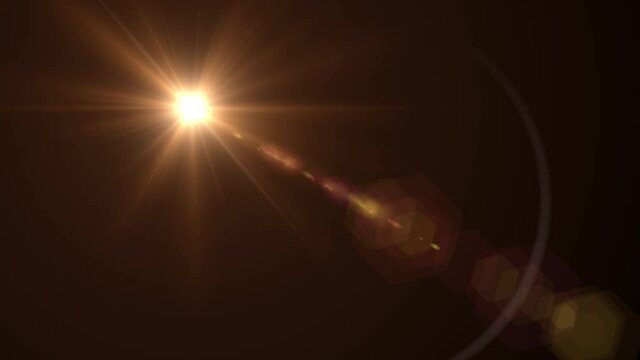 Bright orange sun shining in the dark sky -Rays spinning effect