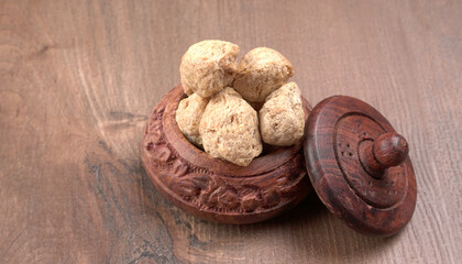 Raw soya chunks on dark background. Healthy, nutritious soybean meat, chunks isolated.Vegan food concept.