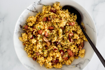 vegan couscous with mixed beans and herbs, healthy plant-based food