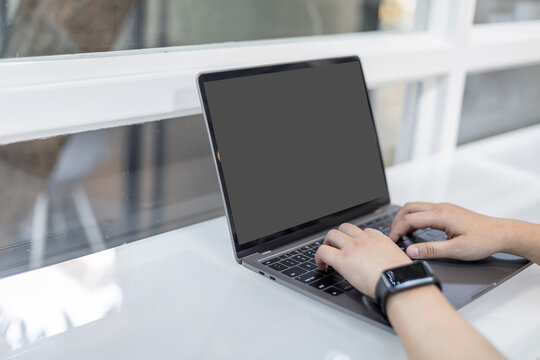 Close-up of freelance people businessfemale wearing generic design smartwatch working with laptop computer and smartphone in at the cafe,Business Lifestyle communication concept