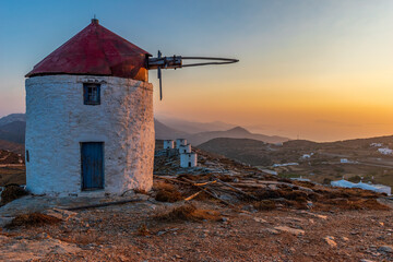 scenic golden hour view of a traditional wind mill in Chora Amorgos  Greece