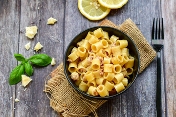 Italian home made   pasta  with  lemon  tuna  fish, parmesan cheese and black pepper .
