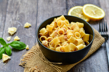  Italian home made   pasta  with  lemon  tuna  fish, parmesan cheese and black pepper .