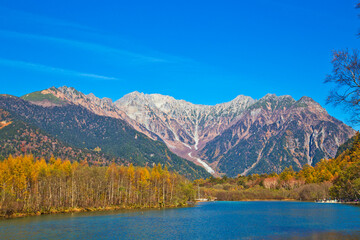 Azusa River flowing through Kamikochi national park in Nagano Prefecture, Japan. The autumn leaves season is beautiful.