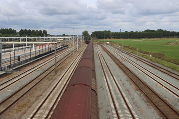Fototapeta premium Railroad tracks for high speed and regular trains at Lage Zwaluwe Station