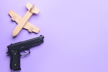 Wooden airplane and gun on color background. Concept of hostage