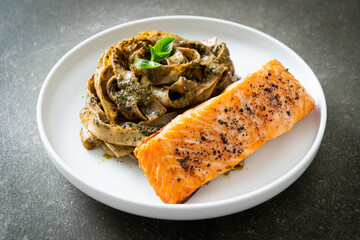 pesto fettuccine spaghetti pasta with grilled salmon fillet