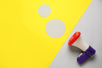 Toy megaphone on color background