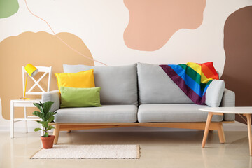 Interior of stylish room with flag of LGBT