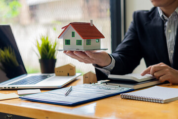 Businessman or home sales representative works Businessman or home sales representative working in...