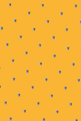 human skull with a pink bow against yellow illuminating background. abstract Halloween art. Halloween. holiday. mortal. skull. pattern