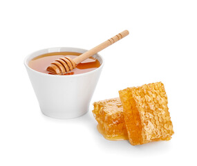 Bowl of honey and combs on white background