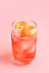 Glass of tasty Negroni cocktail on color background