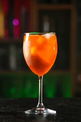 Glass of tasty aperol spritz cocktail on table