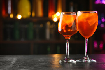 Glasses of tasty aperol spritz cocktail on table