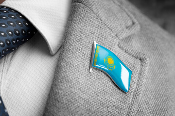 Metal badge with the flag of Kazakhstan on a suit lapel