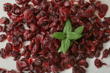 Tasty dried cranberries on light background, closeup