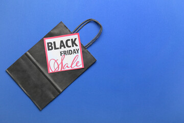 Shopping bag and card with text BLACK FRIDAY SALE on color background