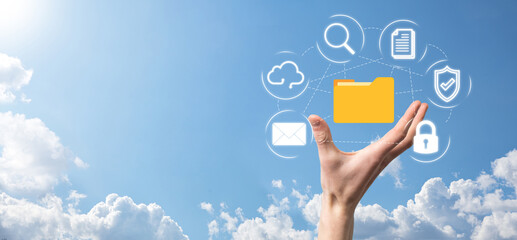 Document Management System DMS .Businessman hold folder and document icon.Software for archiving, searching and managing corporate files and information.Internet Technology Concept.Digital security