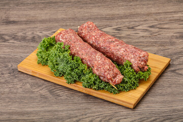 Raw minced beef kebab skewer