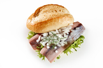 Sandwich with fish on white table