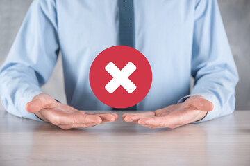 Hand holds icon,cancellation symbol,cancel icon.Cross mark flat red icon.round X mark.cancel...
