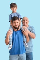 Fototapeta premium Happy man, his little son and father on color background