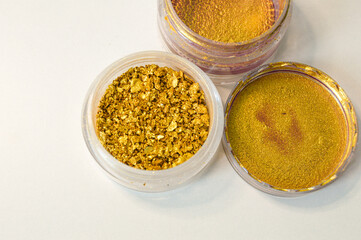 Gold powder in a jar