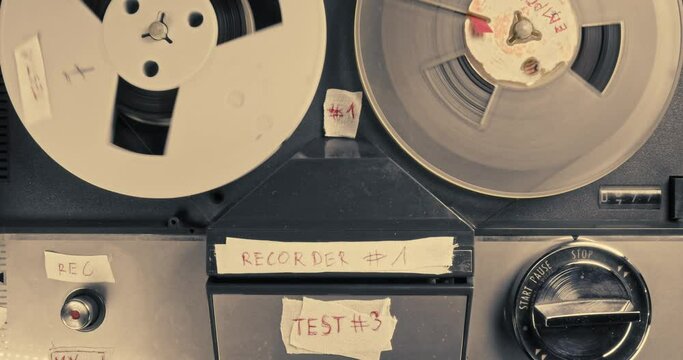 Vintage reel audio recorder and tape rolls. Audio reel player. 