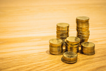 Gold coins stacks is representing riches and wealth management. Coin stack growing and find out the way to get a return on investment. Finance and money exchange investment as concept.	
