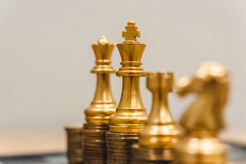 Finance and money exchange investment as concept.	Gold coins stacks is representing riches and wealth management. Coin stack growing and find out the way to get a return on investment. 