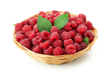 Red juicy raspberries in wicker vase, isolated on white background