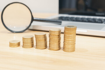 Gold coins stacks is representing riches and wealth management. Coin stack growing and find out the way to get a return on investment. Finance and money exchange investment as concept.