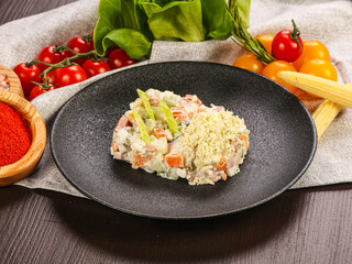 Traditional Russian salad Olivier with sausages