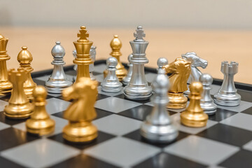 Closeup of chess characters on board games. to represent decision making in term of business strategy to find out the best solution to meet target objective and goal.