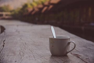 Coffee cup and beans on old vintage table. Top view with copy space for your text into the...