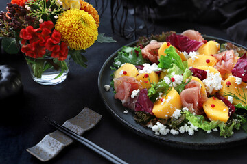 Persimmon and prosciutto ham autumn appetizer salad for Halloween or Thanksgiving. 柿と生ハムの秋サラダ　オータムサラダ