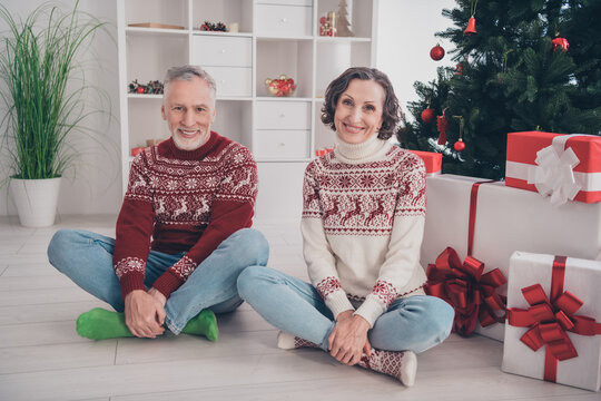 Full Size Photo Of Funky Couple Old Lady Man Sit With Present Wear Sweater Jeans Socks At Home