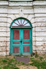 old green door entrance to the building